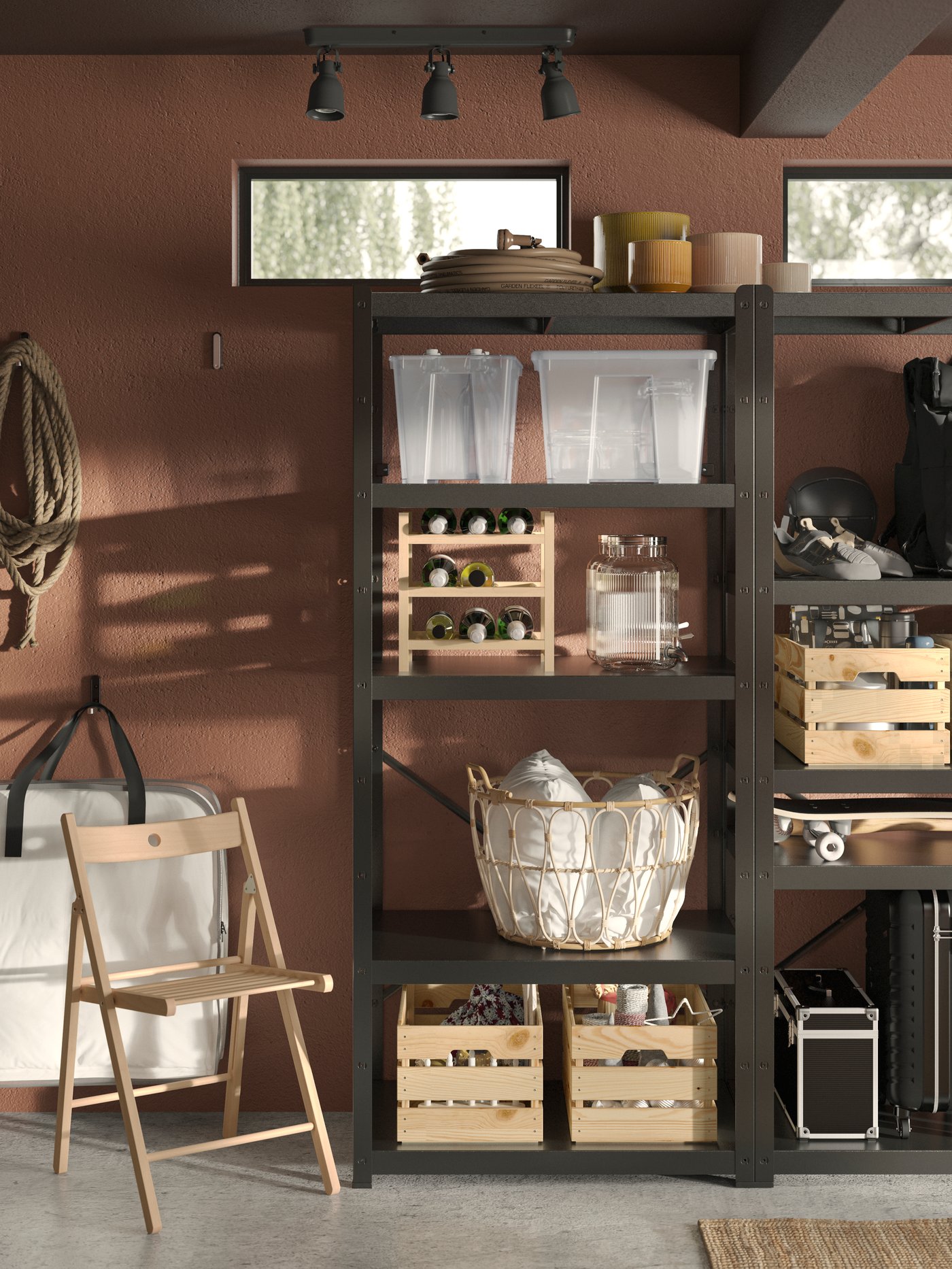 Part of a garage where miscellaneous storage is neatly arranged hanging on the wall, in boxes and in BROR shelving units.