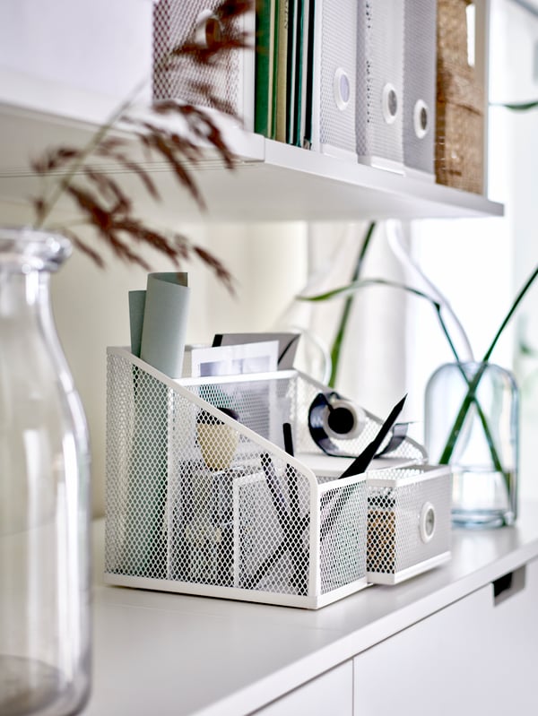 A white DRÖNJÖNS desk organiser in the home office