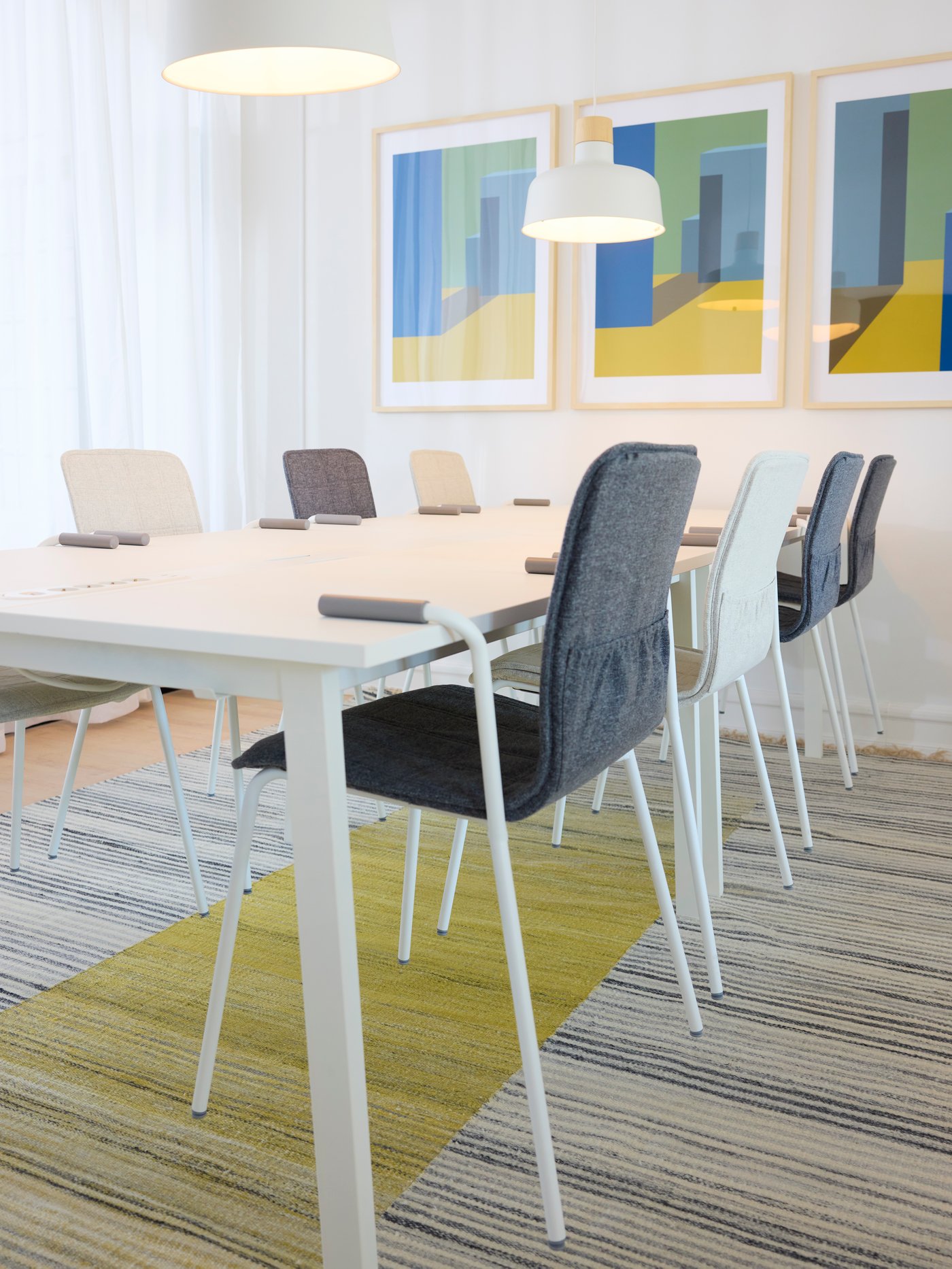 A Gunnared medium grey LÄKTARE chair cover in the home office