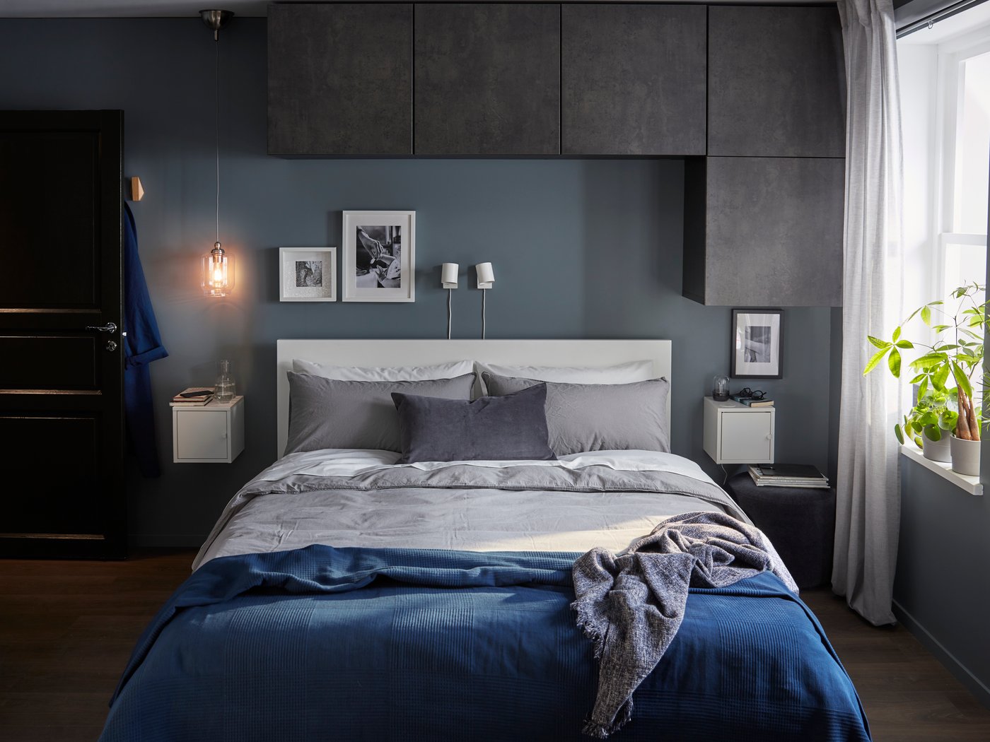 A dark grey SANELA cushion cover in the bedroom