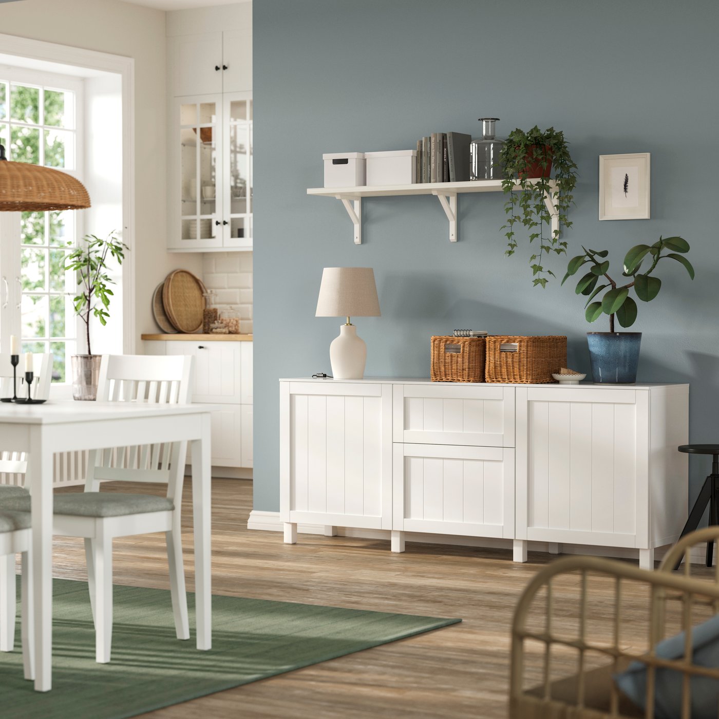 BESTÅ and PIPMAKARE white sideboard storage combination with beadboard design in the living room.