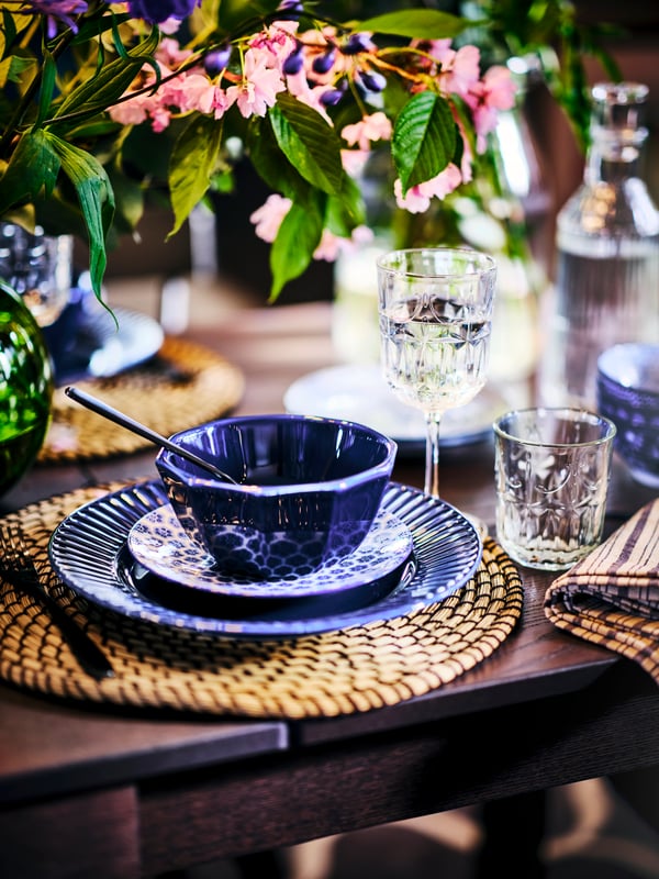 A seagrass/black LÄTTAD place mat