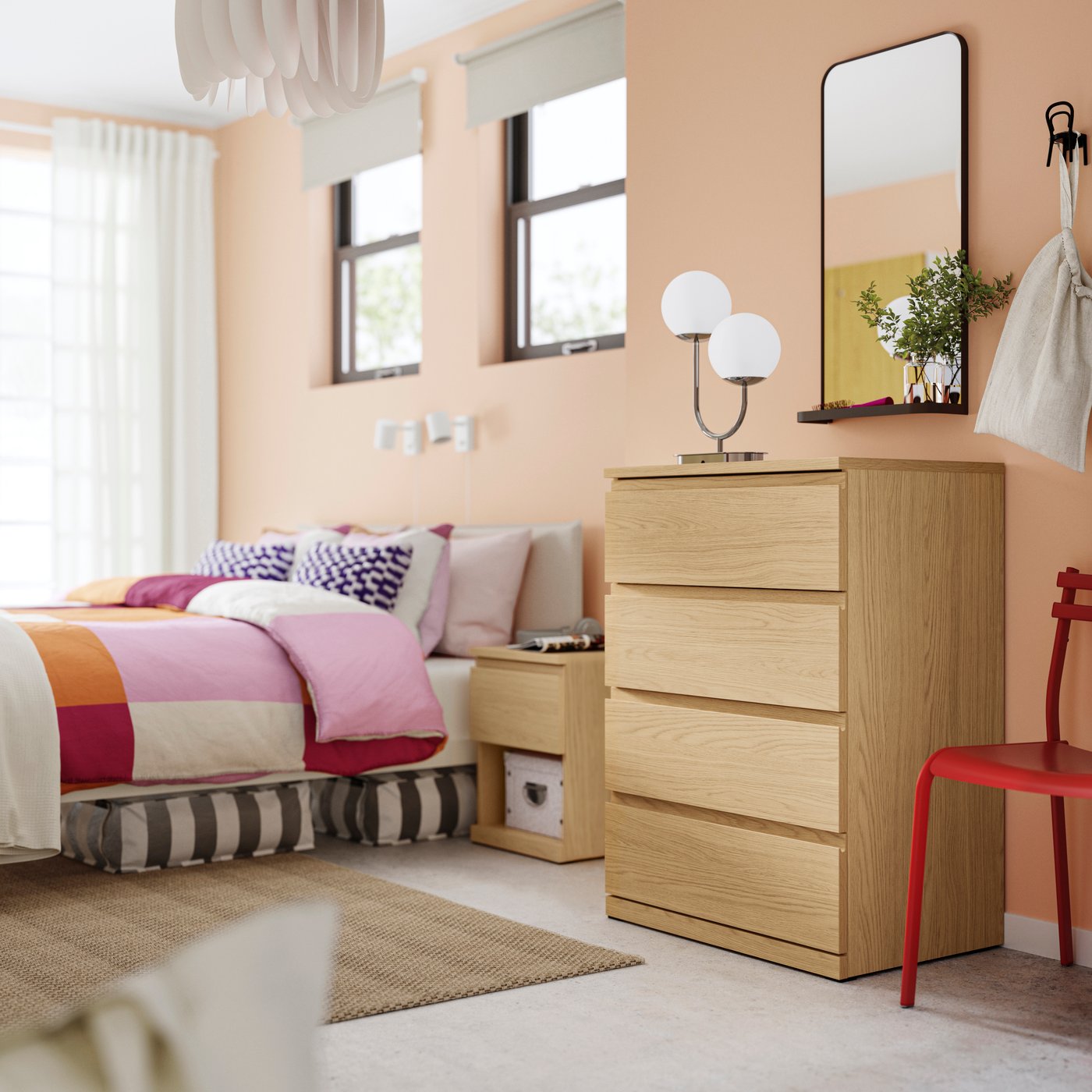 An oak effect STORKLINTA chest of 4 drawers in the bedroom