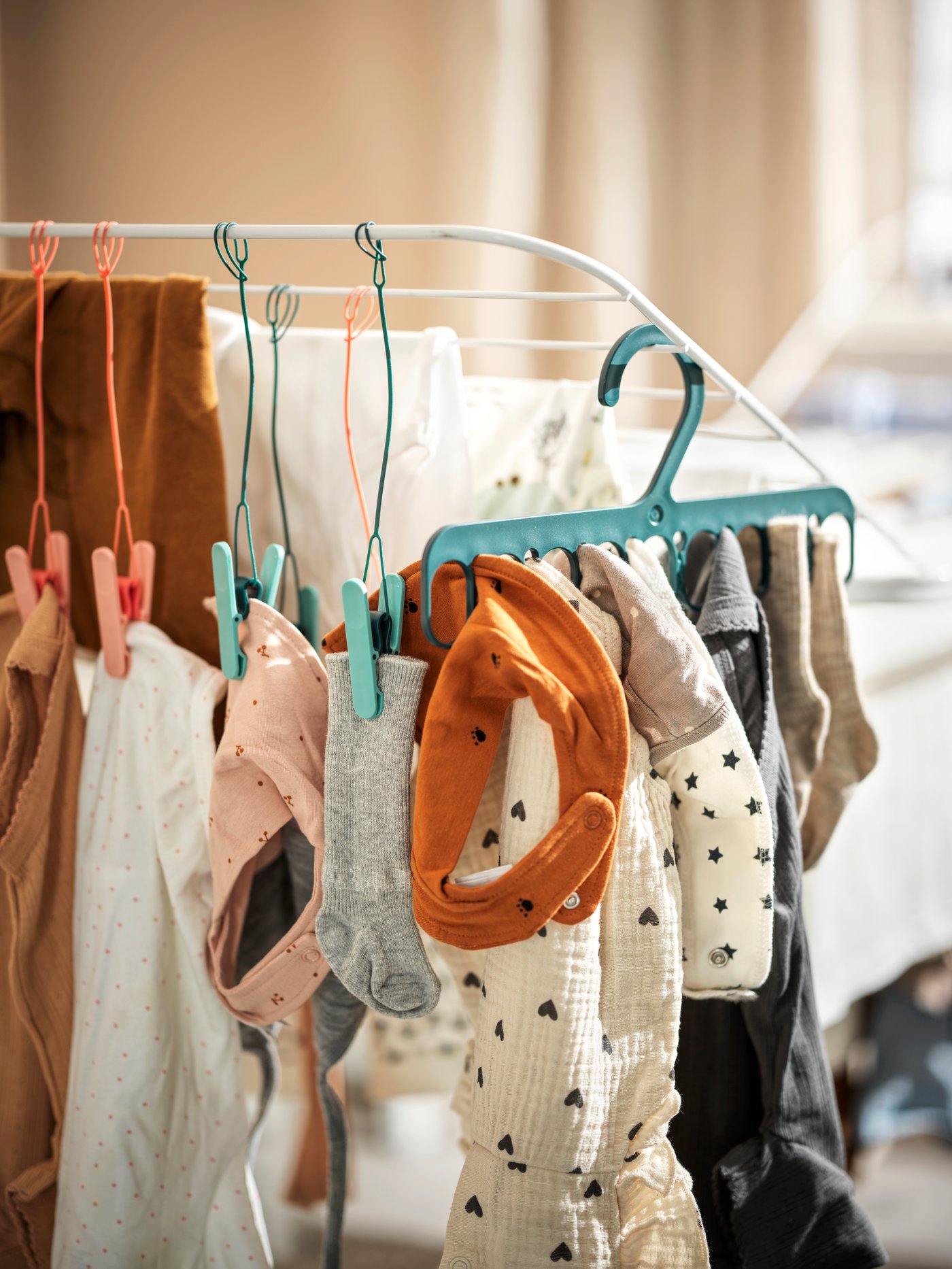 A SLIBB hanger with 8 grip clips in the laundry room