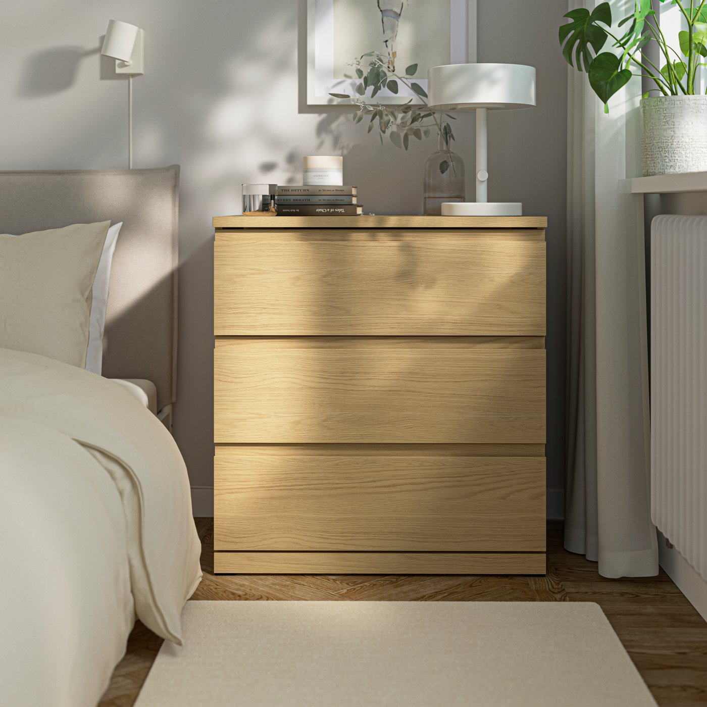 An oak effect STORKLINTA chest of 3 drawers in the bedroom