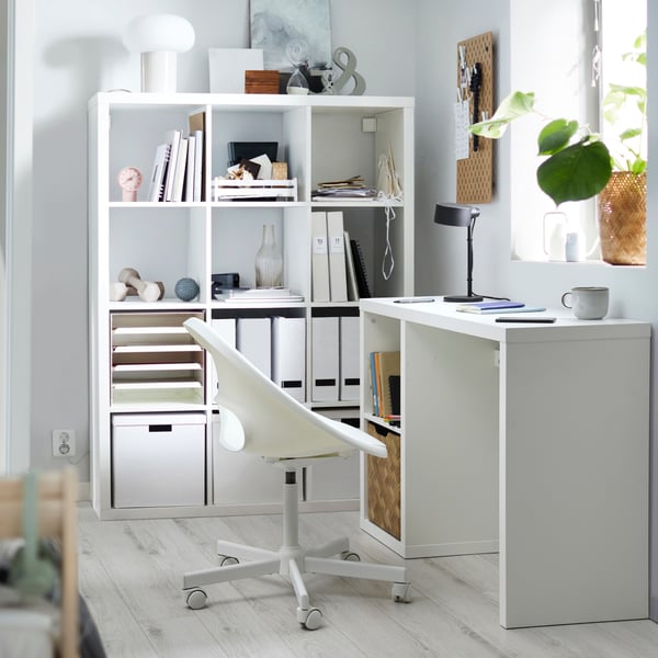 A white KALLAX desk and chair