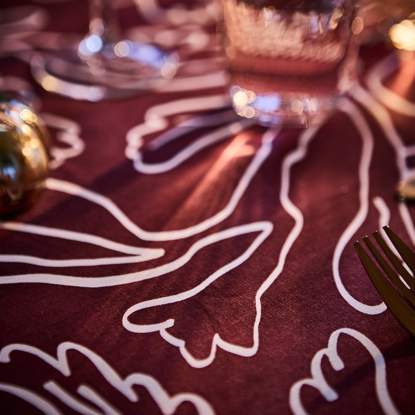 A rose-gold colour FÖRNUFT 24-piece cutlery set in the dining room