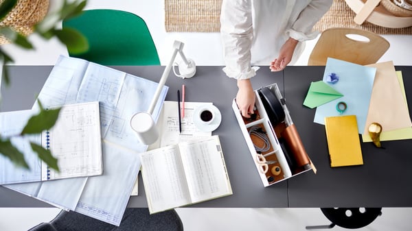 Aerial view of a woman using an IKEA desk and desk tidy .