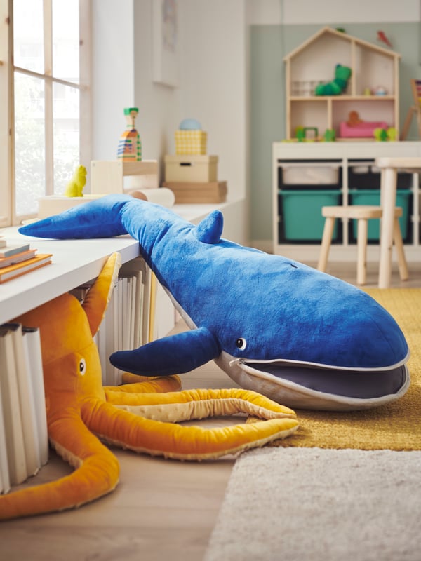 A blue whale BLÅVINGAD soft toy