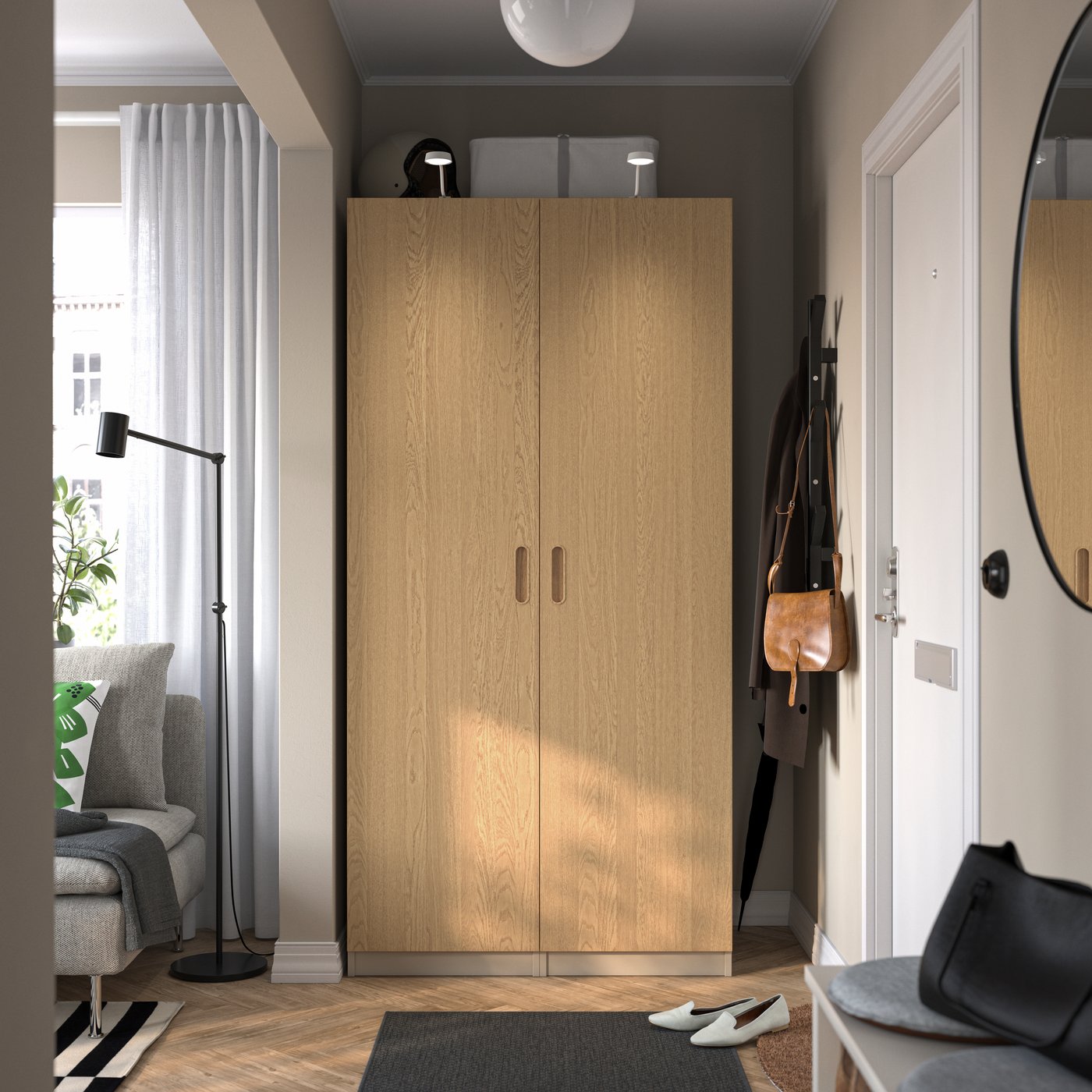 A grey-beige/oak veneer PAX wardrobe combination in the hallway