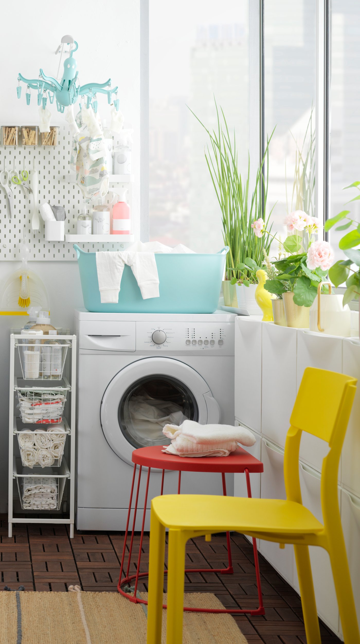 A white SKÅDIS pegboard in the laundry room