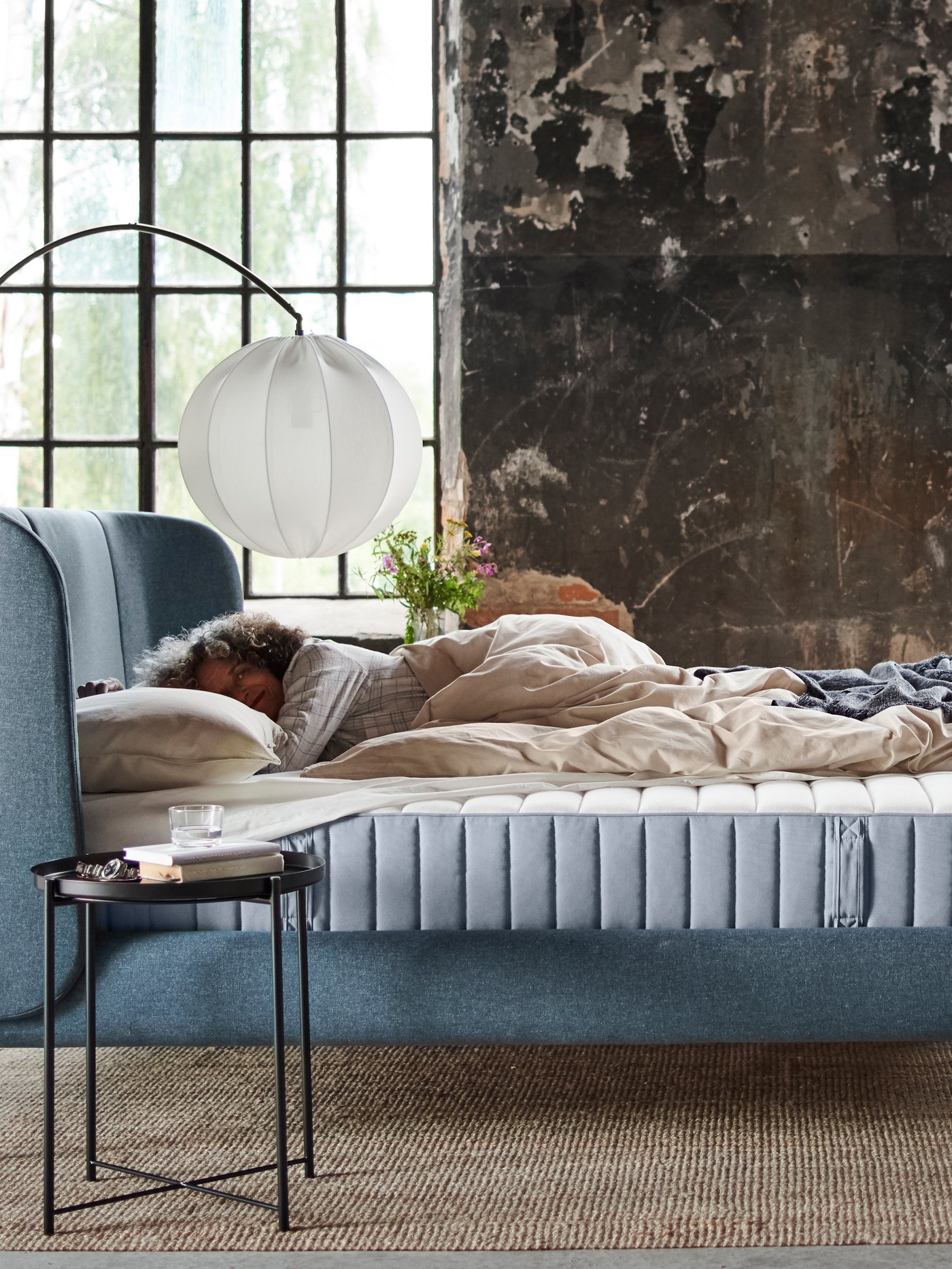 A firm/light blue VALEVÅG pocket sprung mattress in the bedroom.