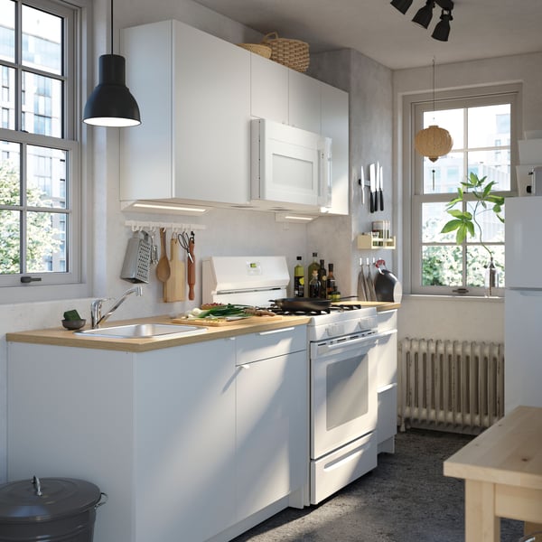 A white LAGAN top-freezer refrigerator in the kitchen