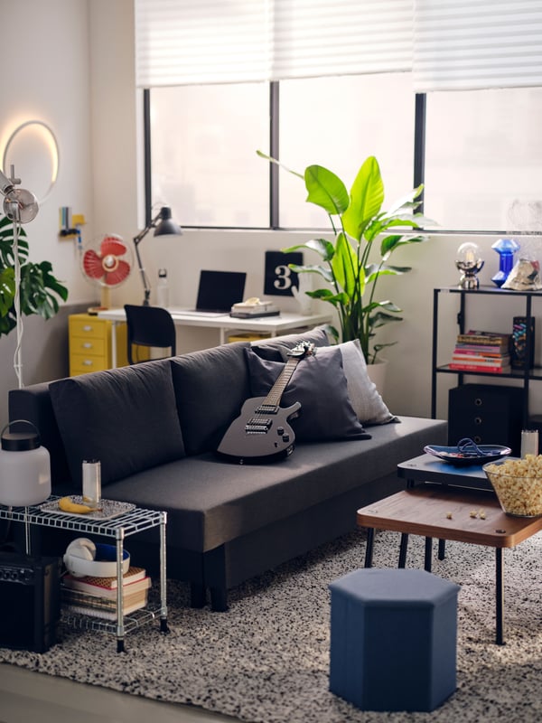A dark grey TERTIAL work lamp in the living room