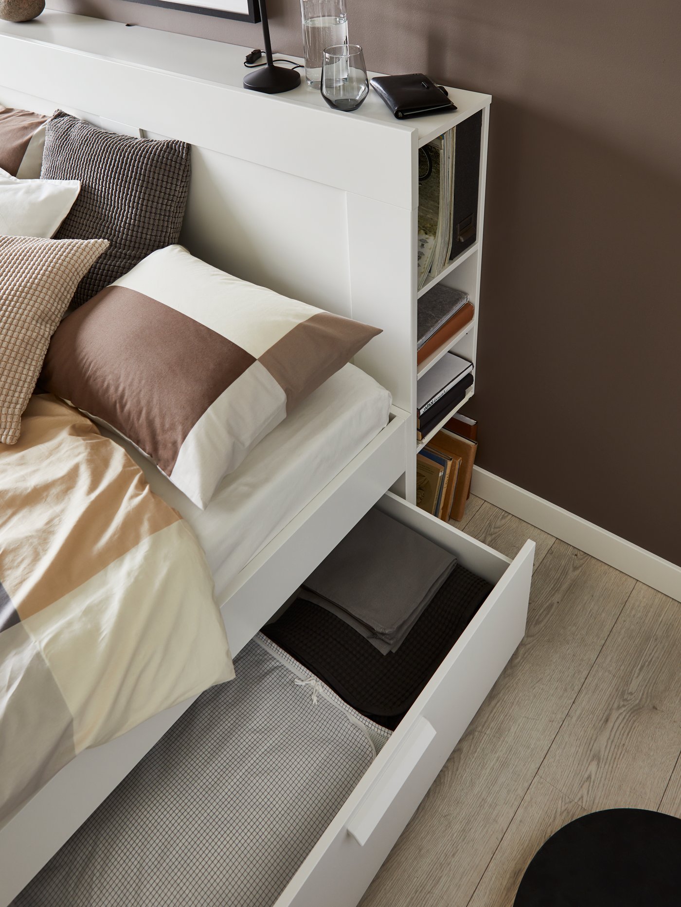 A white/Luröy BRIMNES bed frame w storage and headboard in the bedroom