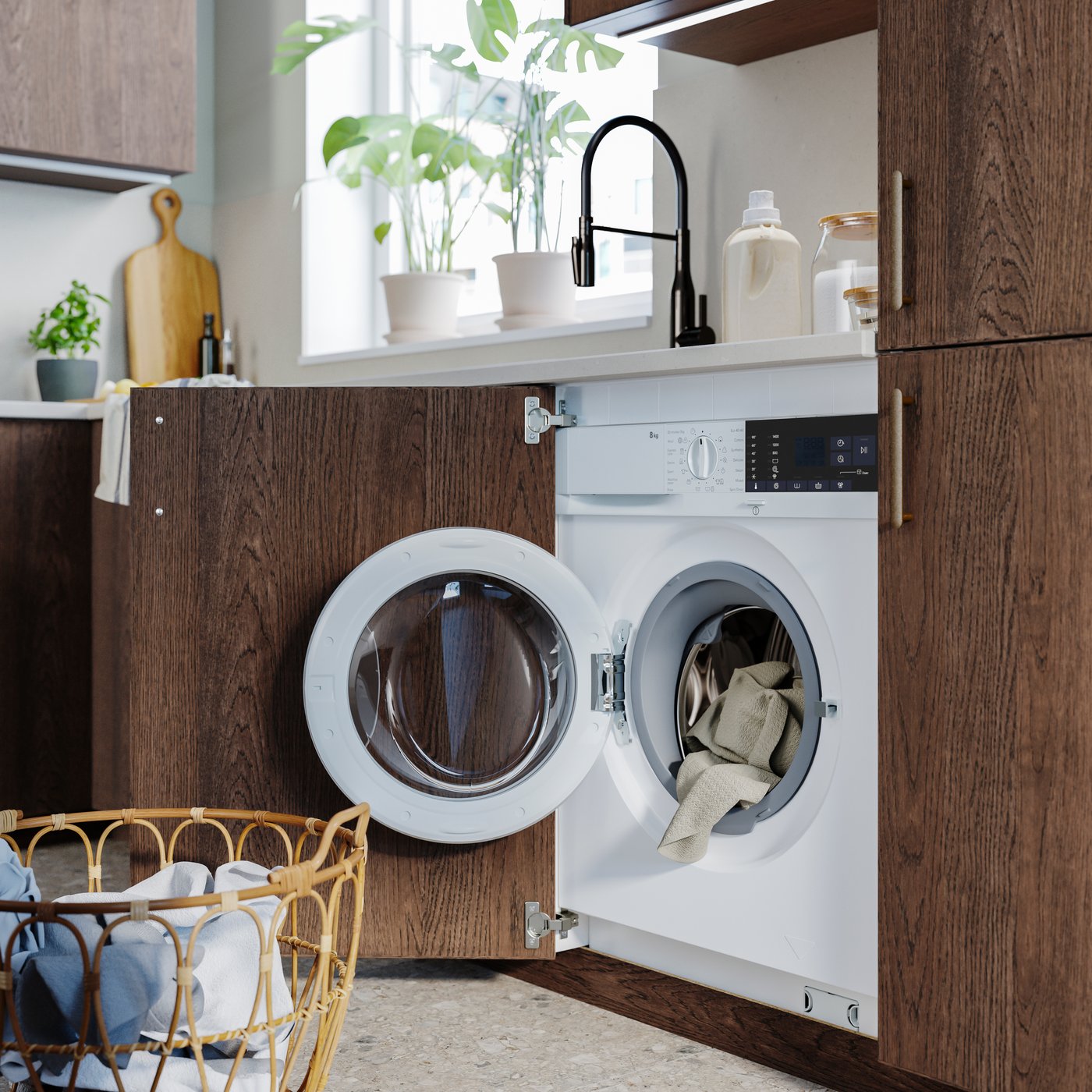 A white TVÄTTAD integrated washing machine