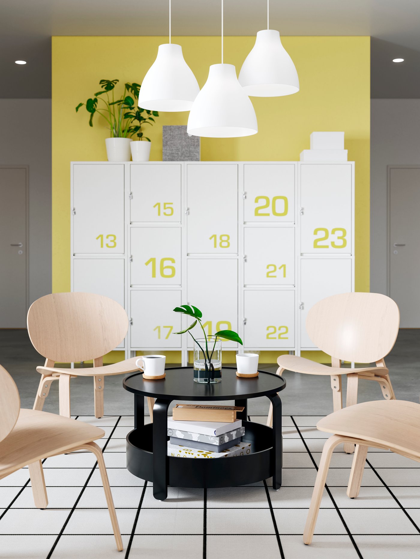 Four FRÖSET chairs in light wood and a black coffee table, two mugs and a plant, creating a relaxing zone in the office.