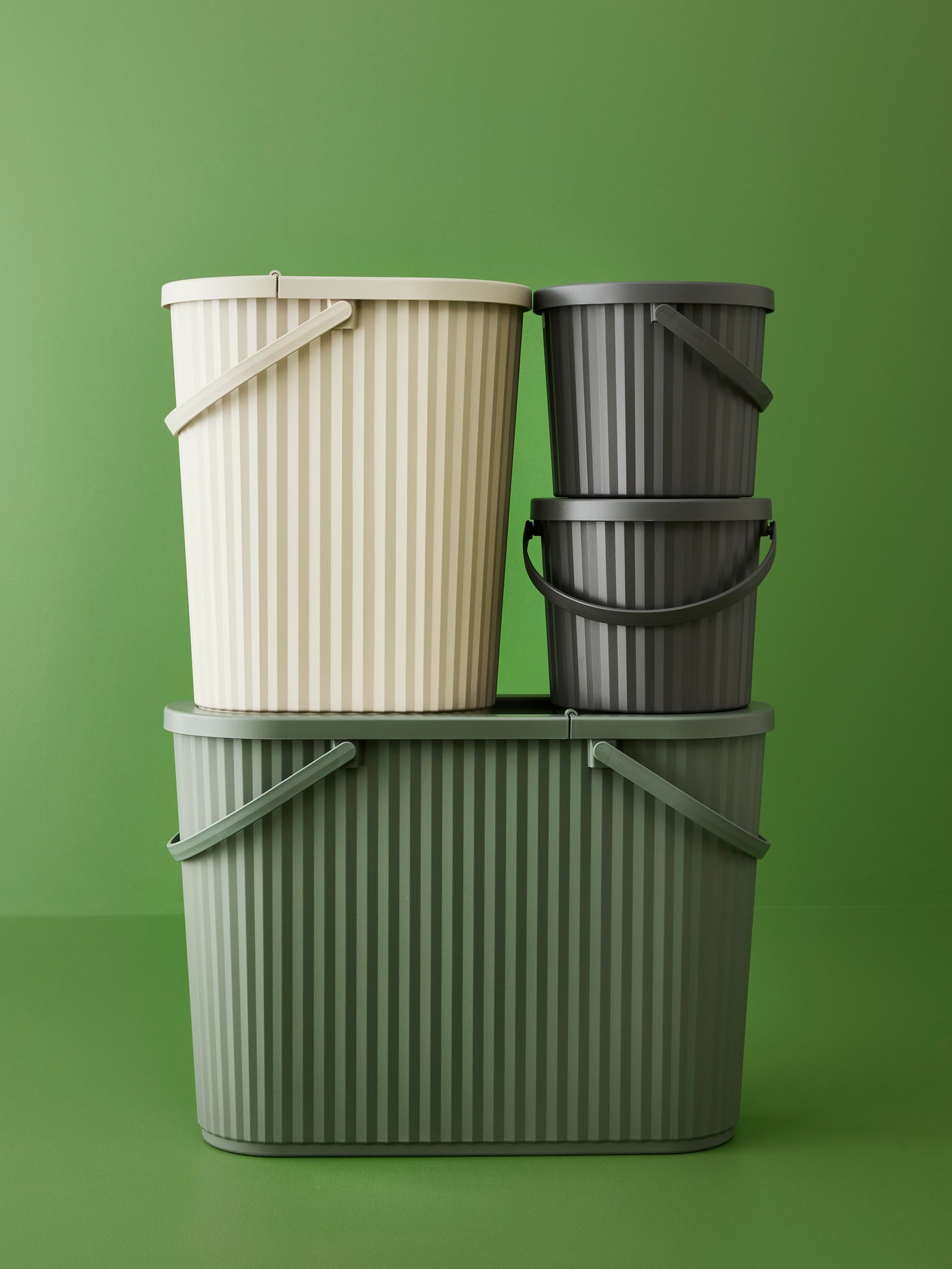 A grey-green DAMMÄNG bin with lid