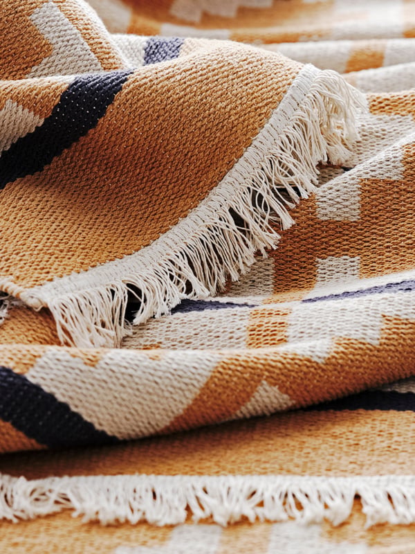 An yellow-beige TELEGRAFLINJE rug, flatwoven