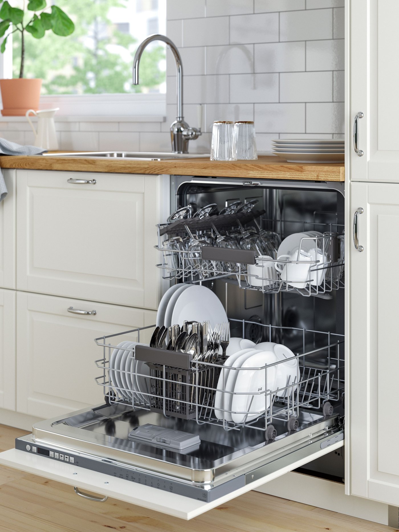 An IKEA 500 RÅGLANDA integrated dishwasher in the kitchen