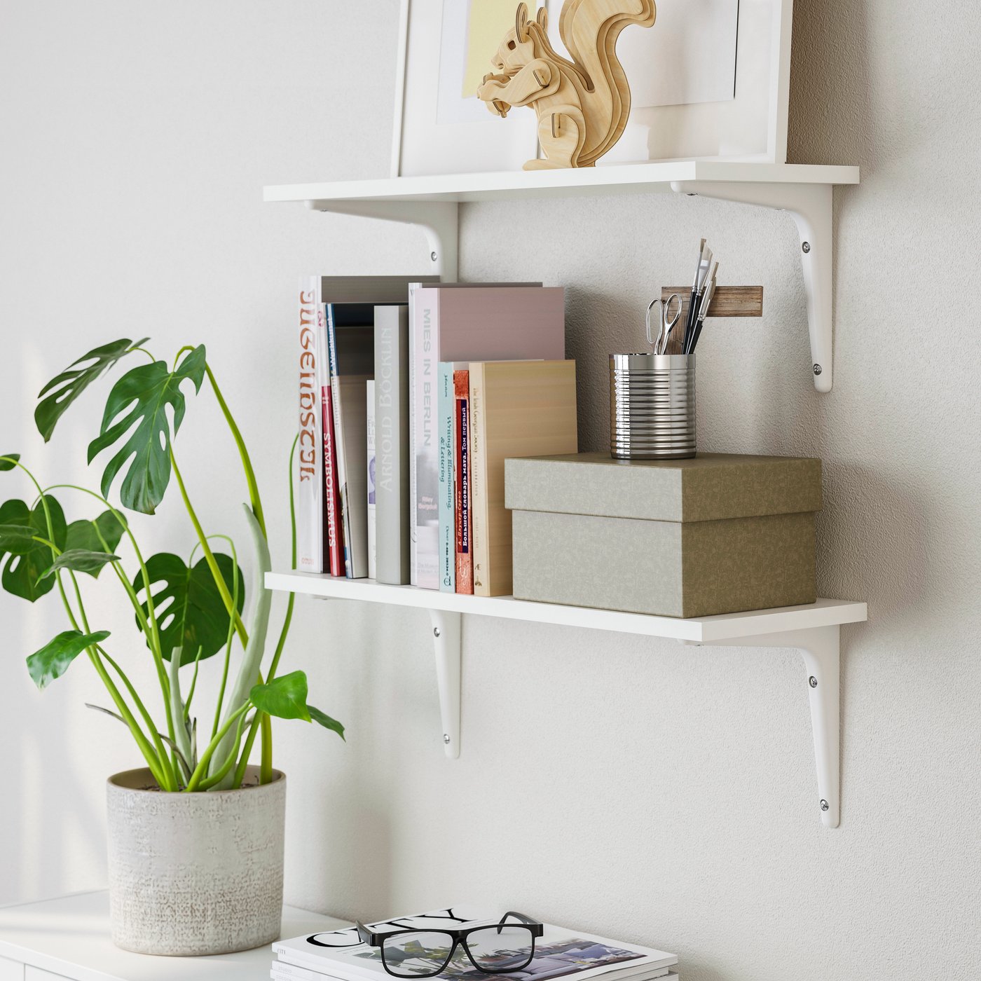 A white/white SIBBHULT wall shelf combination