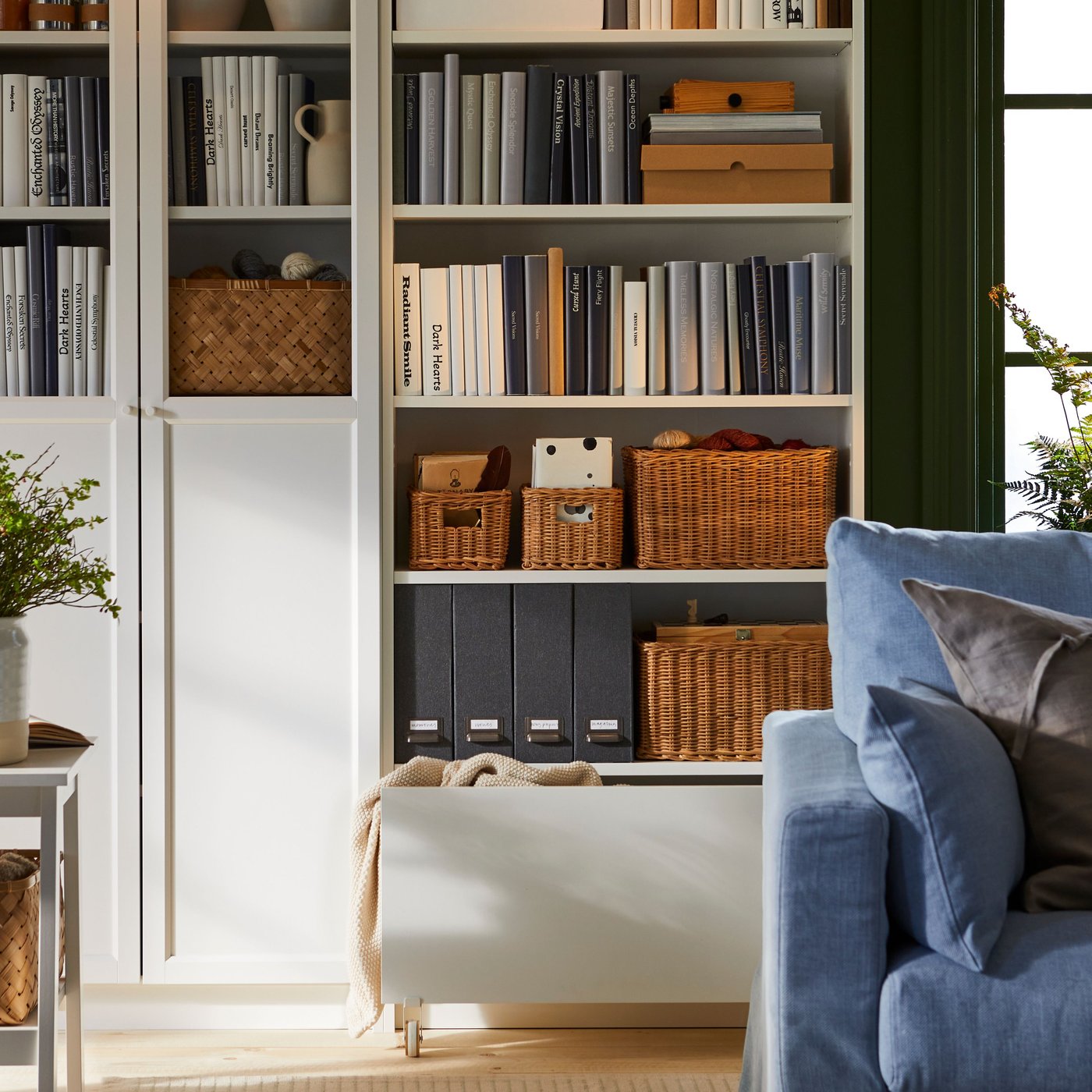 BILLY bookcase in living room area with colourful books displayed on shelvings