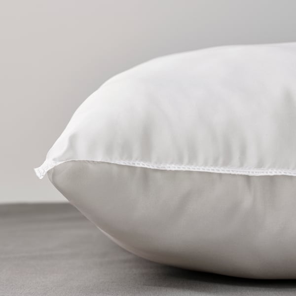A SANDGRÄSMAL pillow in the NA