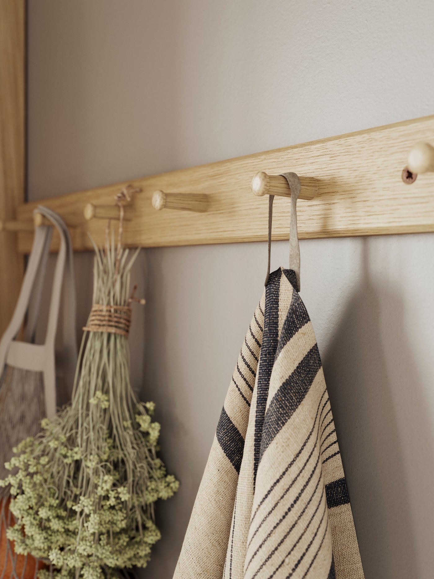 An oak HÖVOLM rack with 6 knobs