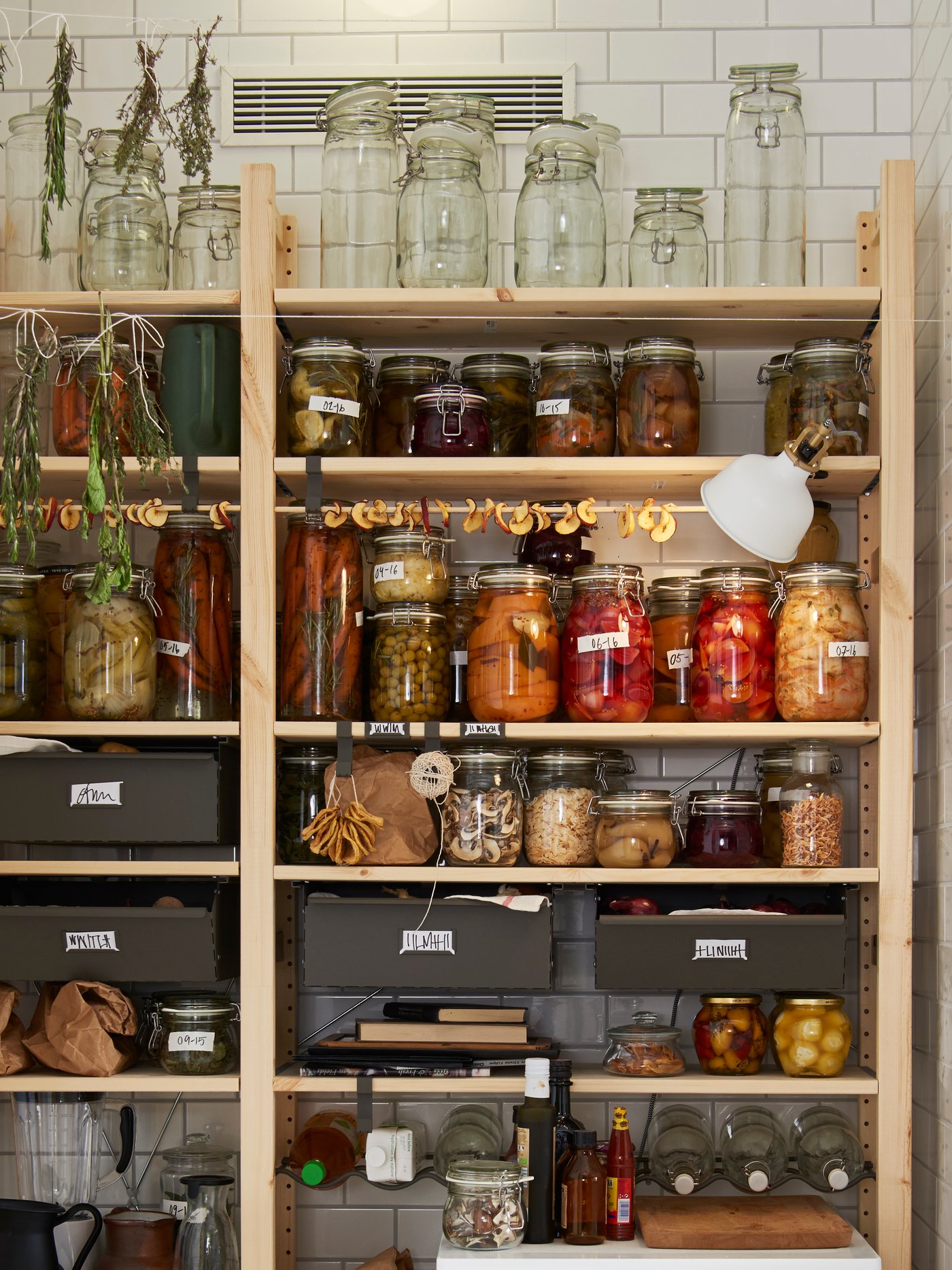 A pine IVAR shelving unit in the kitchen