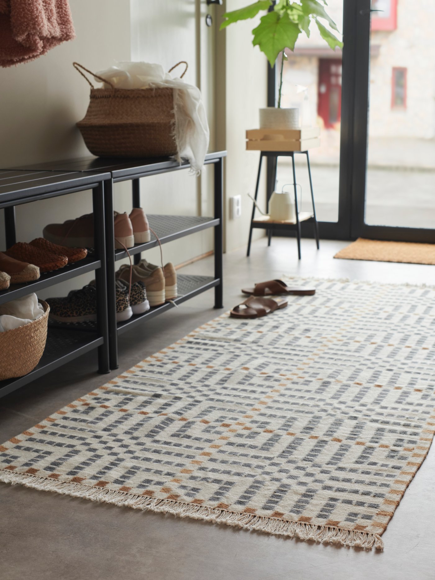 A handmade/multicolour VAMDRUP rug, flatwoven in the hallway