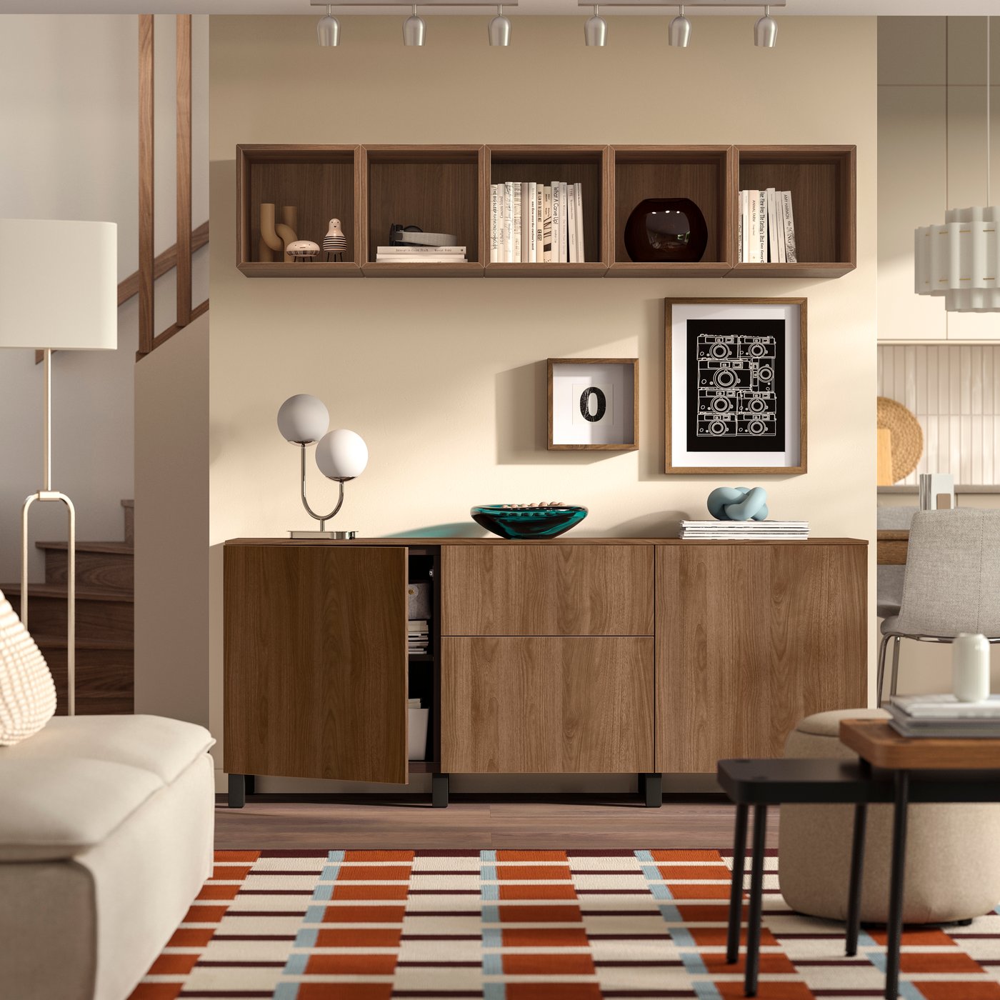 A black-brown/Lappviken/Stubbarp walnut effect BESTÅ storage combination with drawers in the living room.