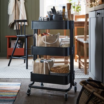 A black RÅSKOG trolley