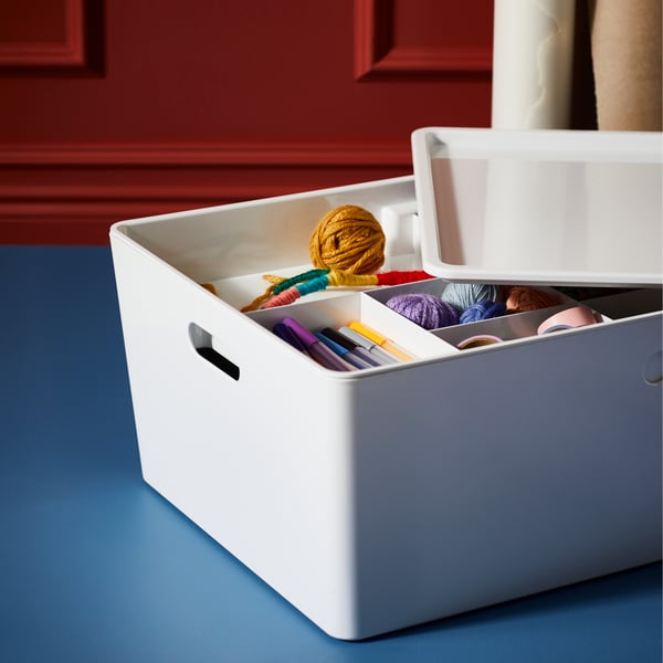 KUGGIS insert on KUGGIS storage box with 8 compartments, showing different types of stationery being neatly organised and classified.