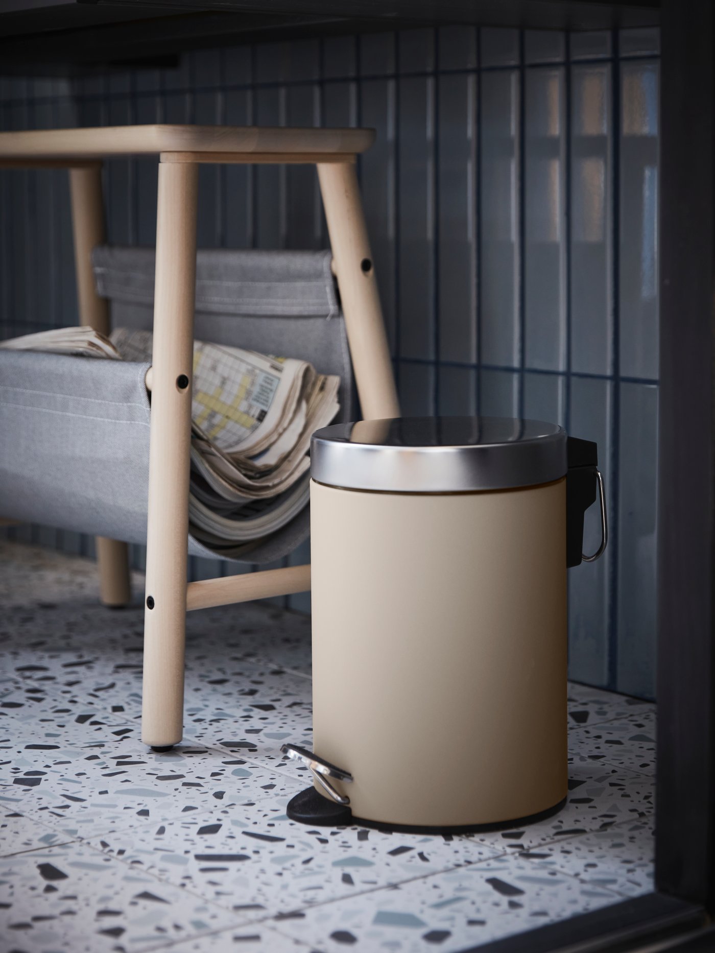 A beige EKOLN waste bin