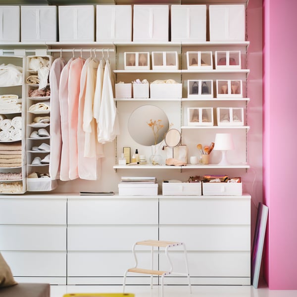 A white SKUBB storage with 9 compartments in the bedroom