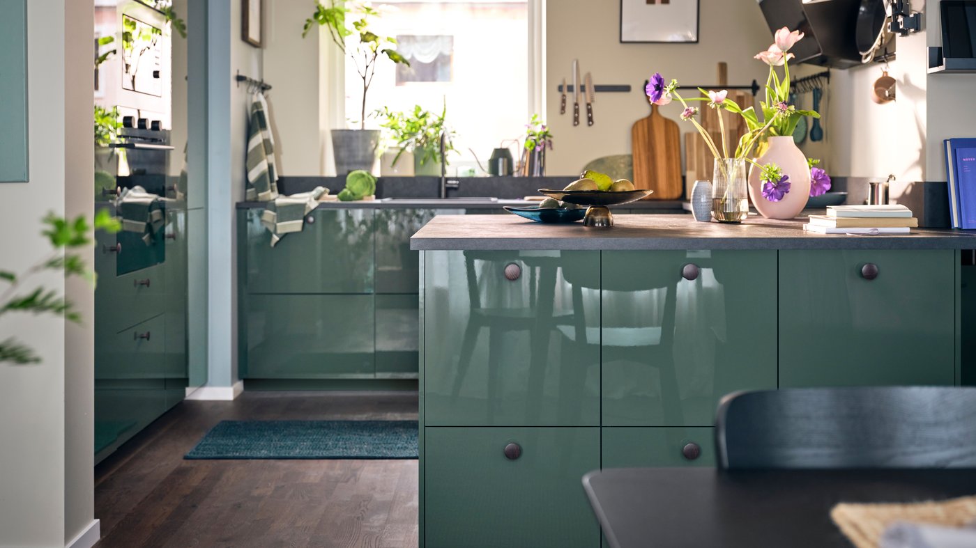 A high-gloss dark grey-green KALLARP door in the kitchen