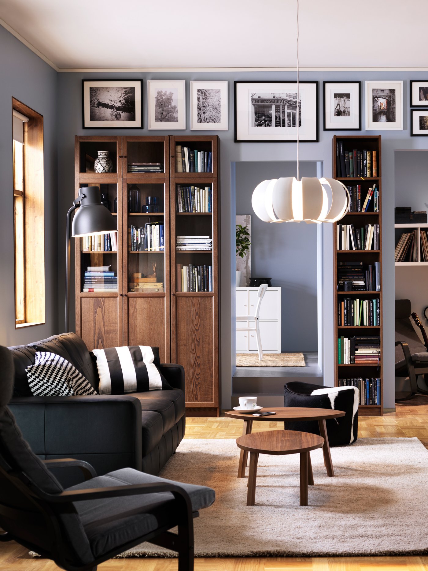 A dark grey HEKTAR floor lamp in the living room