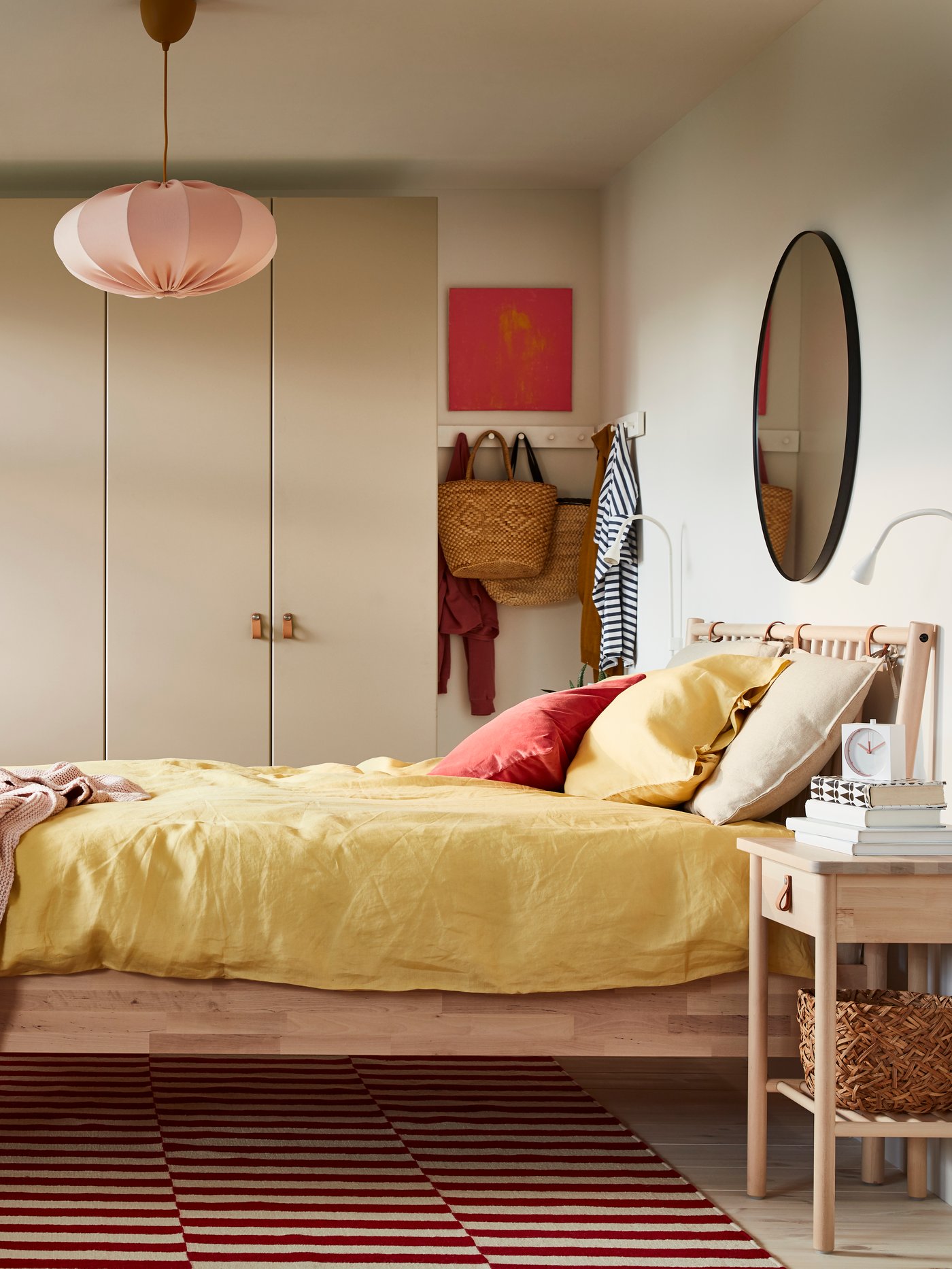A dark grey LANGESUND mirror in the bedroom