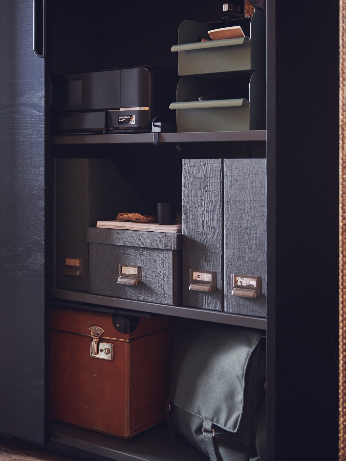 A grey-green/metal REJSA box in the home office