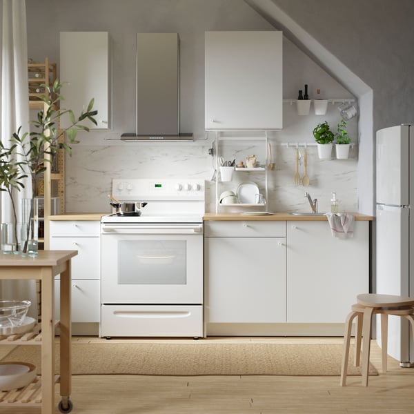 A birch KYRRE stool in the kitchen