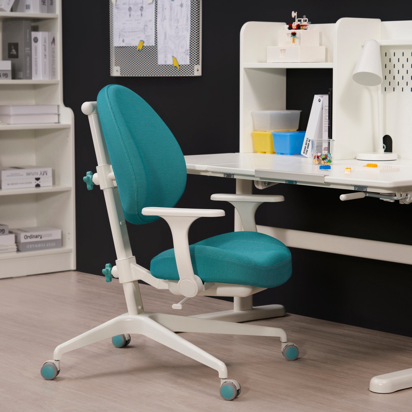 A turquoise GUNRIK children's desk chair
