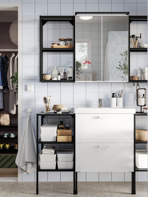 A bathroom with an ENHET bathroom set including a white base cabinet for wash-basin with 2 drawers under a mirror cabinet.