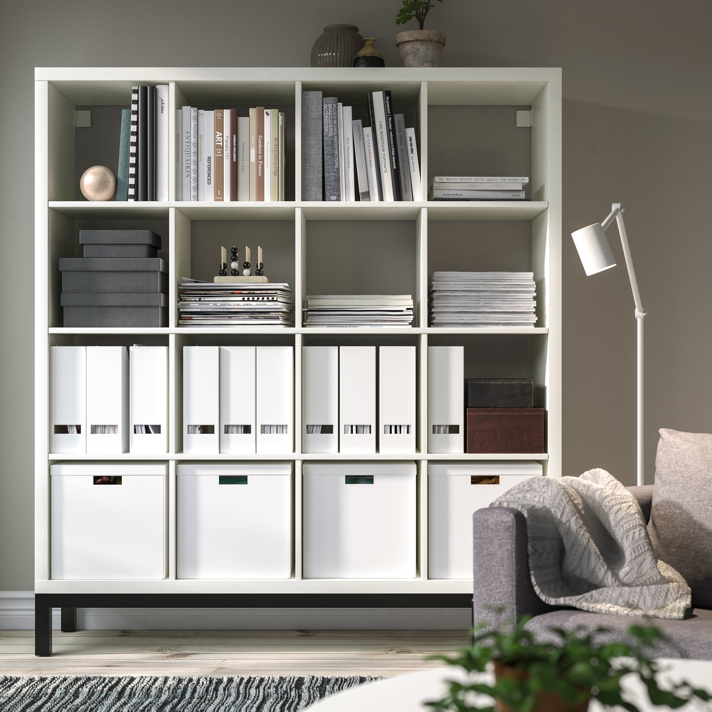 A white/black KALLAX shelving unit with underframe