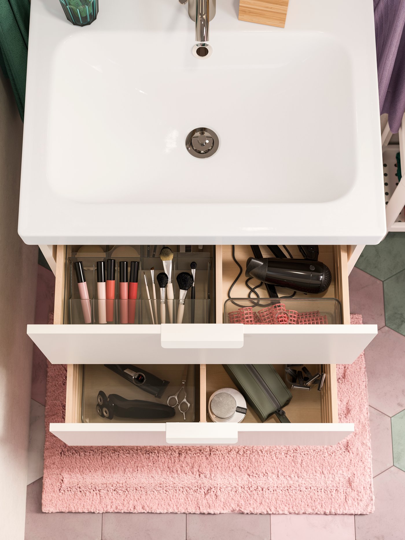 A white wash-stand with two open drawers. Inside are smoked see-through boxes that help organise makeup and more.