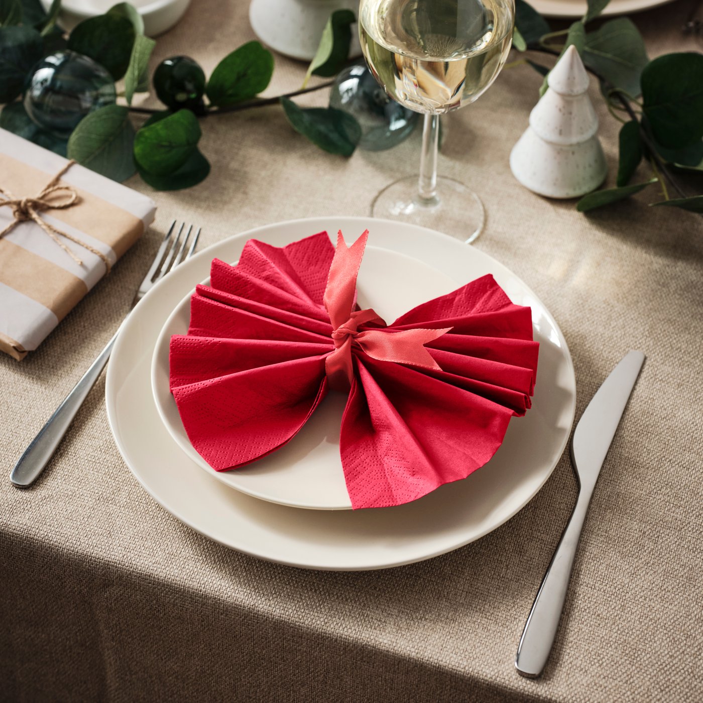 A dark red FANTASTISK paper napkin