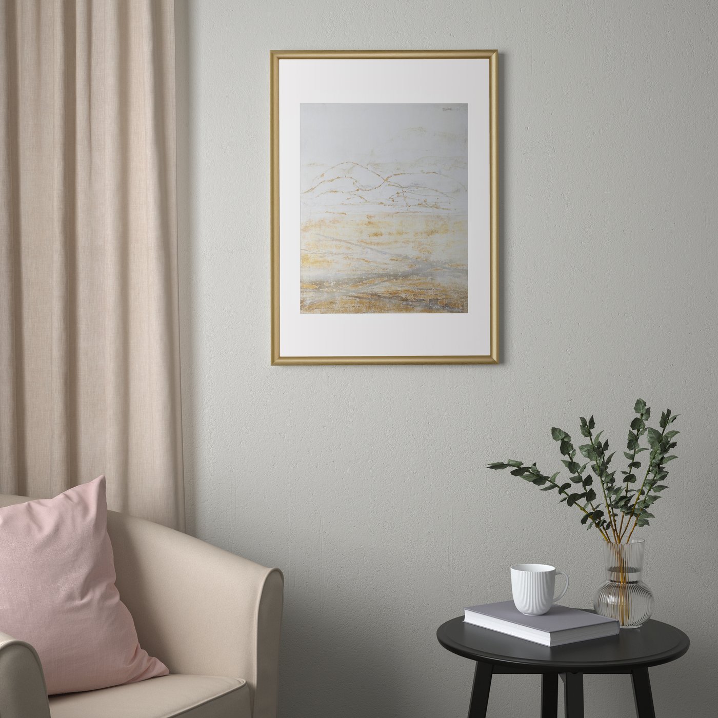 A gold-colour SILVERHÖJDEN frame
