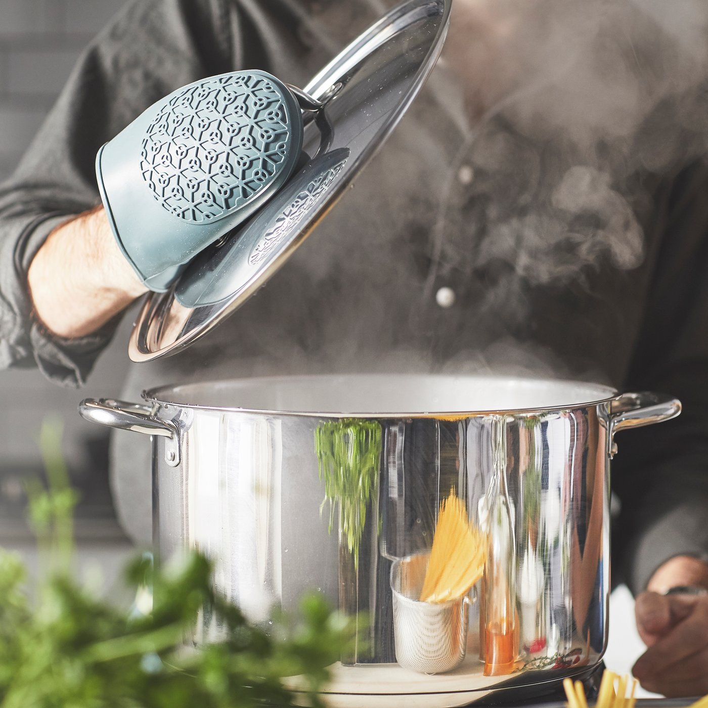A stainless steel IKEA 365+ pot with lid