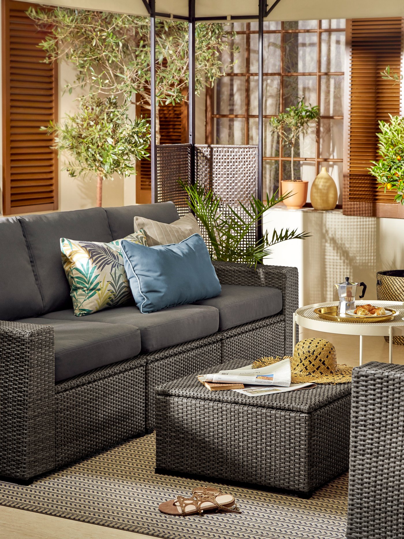 IKEA SOLLERÖN dark grey outdoor 3-seat modular sofa with dark grey Frösön/Duvholmen seat cushions in a terrace or patio