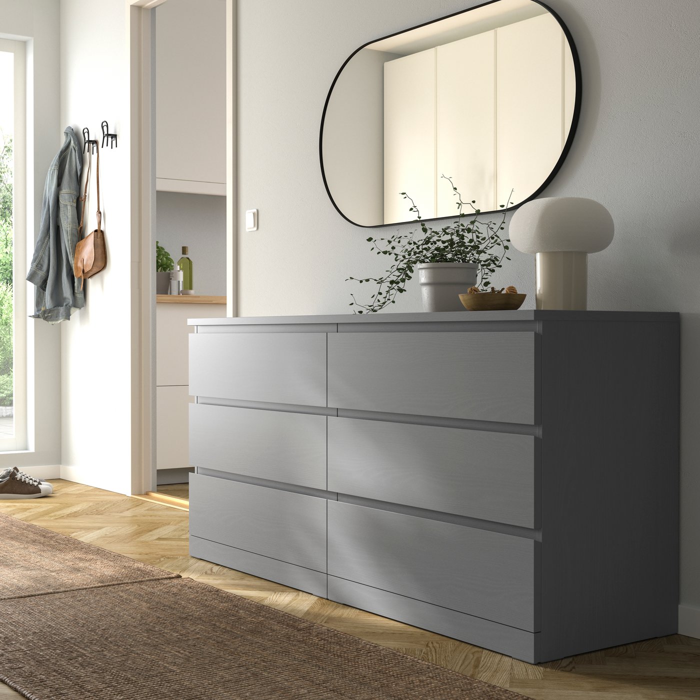 A grey stained MALM chest of 6 drawers