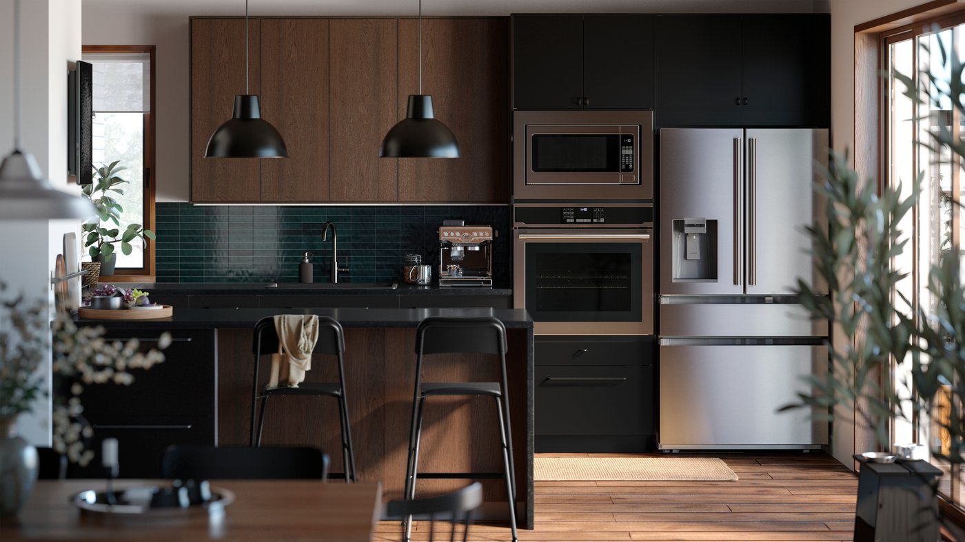 A contemporary kitchen with a kitchen island and a combination of brown SINARP fronts and NICKEBO fronts in matt anthracite.